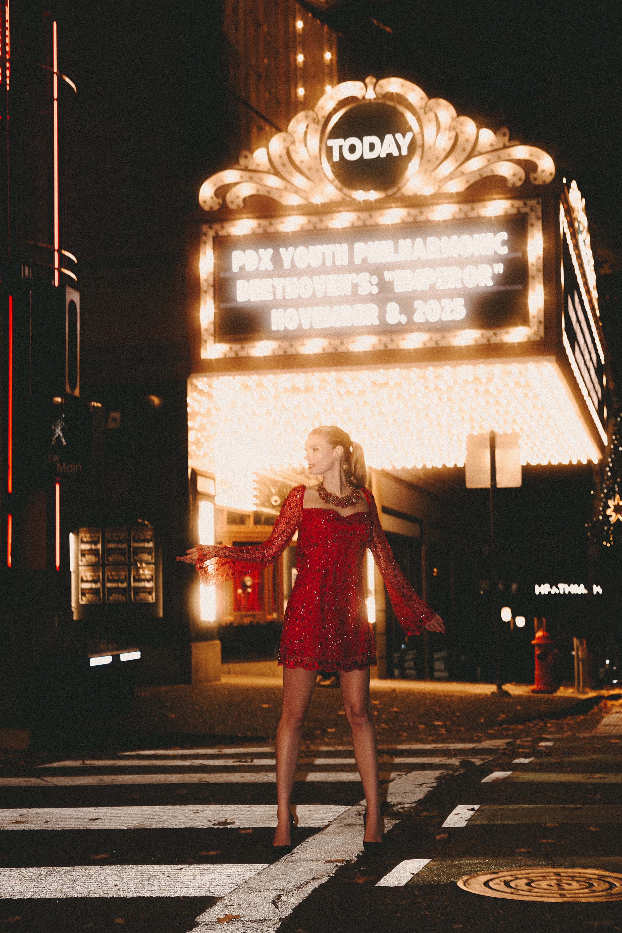 Event photographer red dress theater marquee night portland oregon